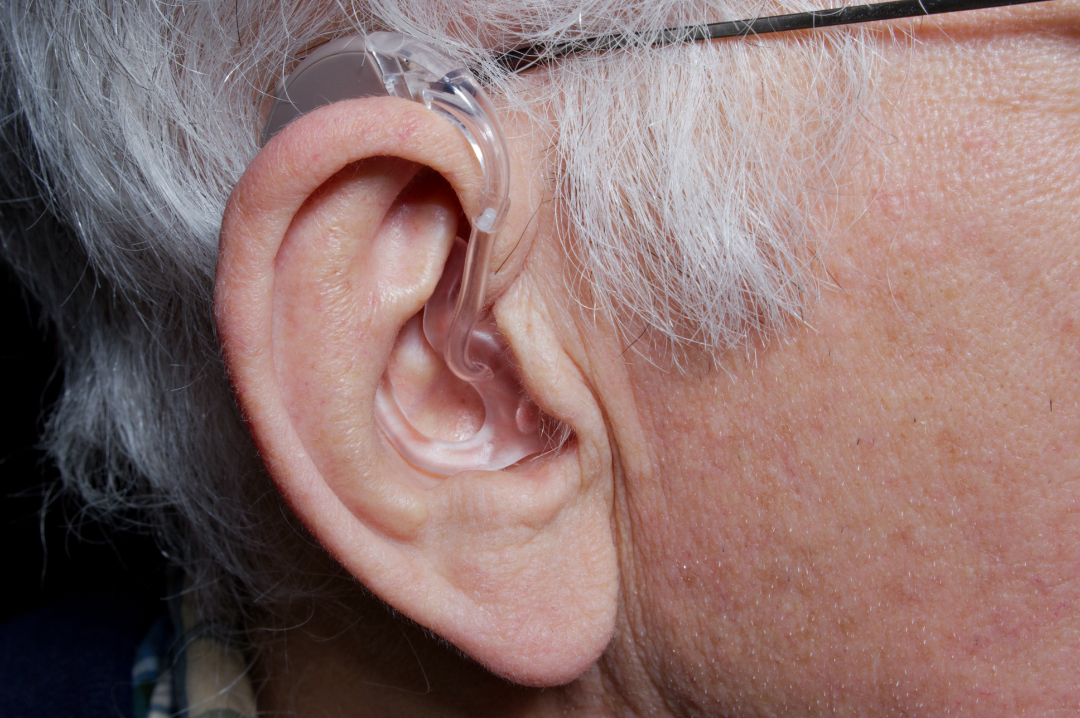 Hearing aid close up side profile photo